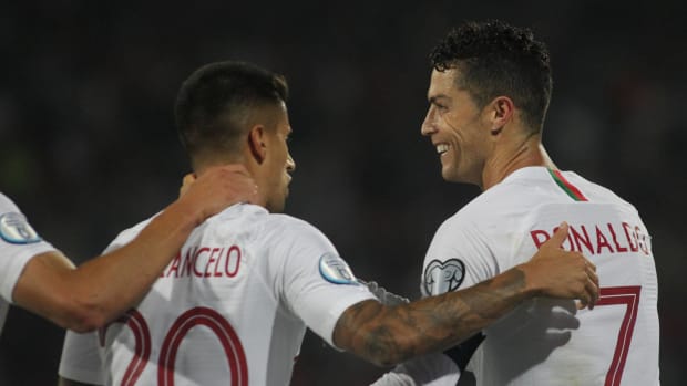Joao Cancelo (left) and Cristiano Ronaldo pictured during Portugal's 4-2 win over Serbia in September 2019